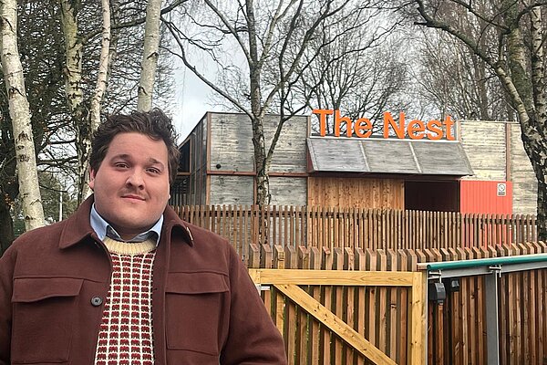 Cllr Chant stood outside The Nest