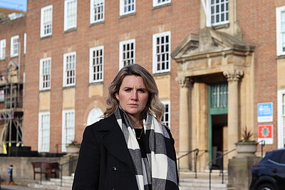 Jess Brown-Fuller MP stood outside County Hall in Chichester