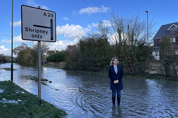 Jess Brown Fuller standing in a flood in Bersted