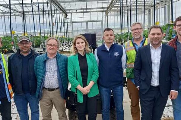 Jess Brown-Fuller with the staff of The Summer Berry Company