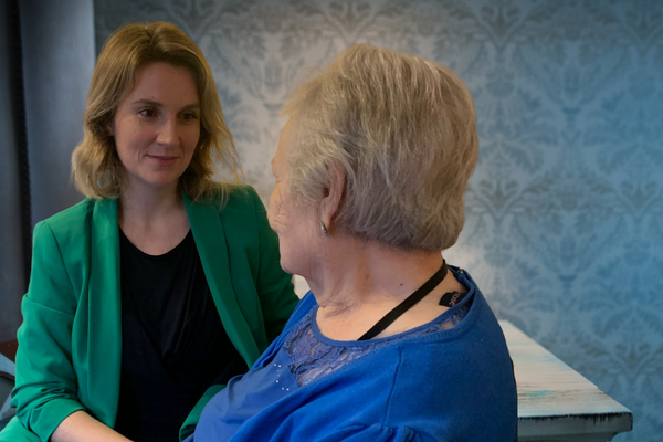 Jess Brown-Fuller speaking with a resident
